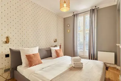 Un ou plusieurs lits dans un hébergement de l'établissement Apartment Opéra by Studio prestige