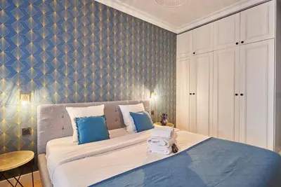 Un ou plusieurs lits dans un hébergement de l'établissement Apartment Opéra by Studio prestige