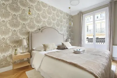 Un ou plusieurs lits dans un hébergement de l'établissement Apartment Opéra by Studio prestige