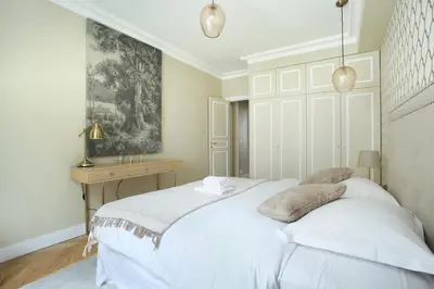 Un ou plusieurs lits dans un hébergement de l'établissement Apartment Opéra by Studio prestige