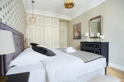Un ou plusieurs lits dans un hébergement de l'établissement Apartment Opéra by Studio prestige