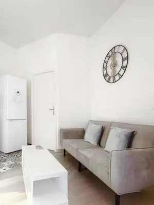 Coin salon dans l'établissement Bel appartement au Marais de Paris