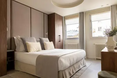 Un ou plusieurs lits dans un hébergement de l'établissement Residence Champs Elysees - Ponthieu