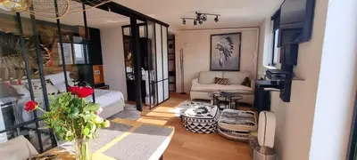 Coin salon dans l'établissement Appartement vue Tour Eiffel paris 16 Eme