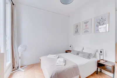 Un ou plusieurs lits dans un hébergement de l'établissement Appartement spacieux à deux pas de Notre-Dame