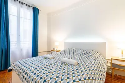 Un ou plusieurs lits dans un hébergement de l'établissement GuestReady - Bel Apt charmant près de Montmartre