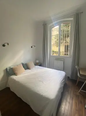 Un ou plusieurs lits dans un hébergement de l'établissement Homy and Cosy private flat - Paris