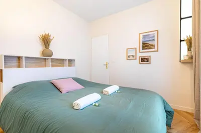 Un ou plusieurs lits dans un hébergement de l'établissement GuestReady - Paris Delight near the metro station