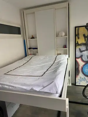 Un ou plusieurs lits dans un hébergement de l'établissement Appartement spacieux et cosy Champs Elysées Arc de triomphe