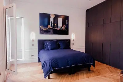 Un ou plusieurs lits dans un hébergement de l'établissement Luxueux duplex Elysées
