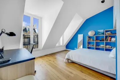 Un ou plusieurs lits dans un hébergement de l'établissement Luxueux duplex Elysées