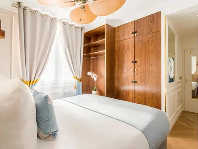 Un ou plusieurs lits dans un hébergement de l'établissement Merveil - Luxury Suite - Notre Dame - Boulangers