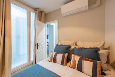 Un ou plusieurs lits dans un hébergement de l'établissement The New Suites, Paris Centre