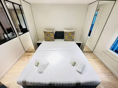 Un ou plusieurs lits dans un hébergement de l'établissement Great flat in center of Paris