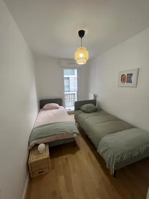 Un ou plusieurs lits dans un hébergement de l'établissement appartement 4 pièces spacieux grande terrasse