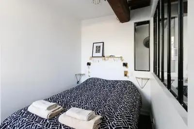 Un ou plusieurs lits dans un hébergement de l'établissement Paris, Bastille, Style atelier d artiste