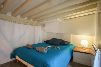Un ou plusieurs lits dans un hébergement de l'établissement Le Marais - Charlot - Appartement de caractere