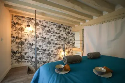 Un ou plusieurs lits dans un hébergement de l'établissement Le Marais - Charlot - Appartement de caractere