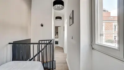 Un ou plusieurs lits dans un hébergement de l'établissement 07 Tour Eiffel - Maison pour 5 personnes