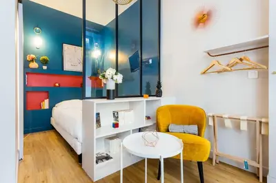 Un ou plusieurs lits dans un hébergement de l'établissement Cosy studio - Arc de Triomphe