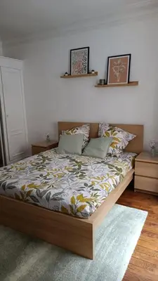 Un ou plusieurs lits dans un hébergement de l'établissement Appartement au coeur de paris à 1 kilomètre de la Tour Eiffel