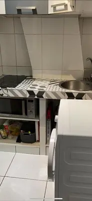 Cuisine ou kitchenette dans l'établissement appartement T2 porte de Pantin Métro Hoche