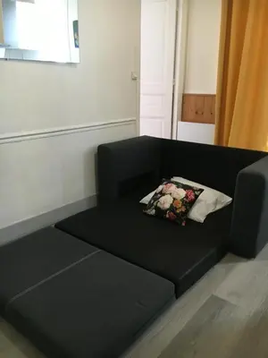 Coin salon dans l'établissement appartement T2 porte de Pantin Métro Hoche
