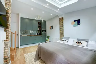 Un ou plusieurs lits dans un hébergement de l'établissement Duplex 4 pax- cour privée