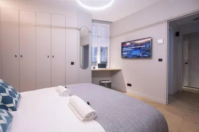 Un ou plusieurs lits dans un hébergement de l'établissement Chic & Fully-Equipped Apartment in Le Marais
