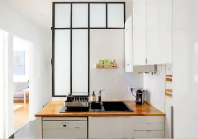 Cuisine ou kitchenette dans l'établissement Charmant appartement près du Père Lachaise