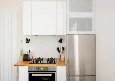 Cuisine ou kitchenette dans l'établissement Charmant appartement près du Père Lachaise
