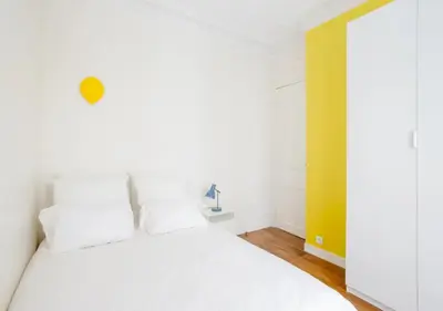 Un ou plusieurs lits dans un hébergement de l'établissement Charmant appartement près du Père Lachaise