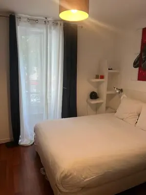 Un ou plusieurs lits dans un hébergement de l'établissement Montmartre-Appartement climatisé -3min Sacré-Cœur