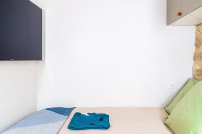 Un ou plusieurs lits dans un hébergement de l'établissement Lavie Maison AC & Jacuzzi