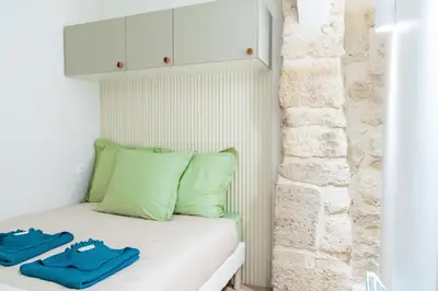 Un ou plusieurs lits dans un hébergement de l'établissement Lavie Maison AC & Jacuzzi