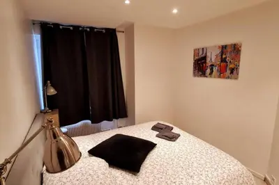 Un ou plusieurs lits dans un hébergement de l'établissement Appart cosy et fonctionnel, quartier très sympa