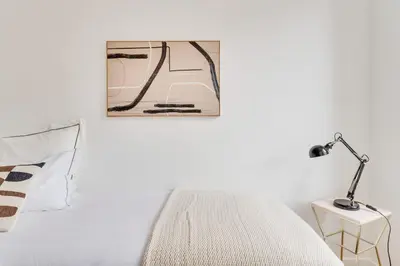 Un ou plusieurs lits dans un hébergement de l'établissement PorteMaillot & La Défense 4 Bedroom 10 people