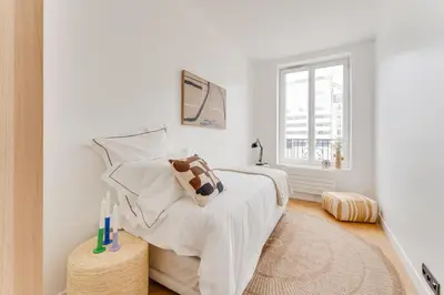 Un ou plusieurs lits dans un hébergement de l'établissement PorteMaillot & La Défense 4 Bedroom 10 people