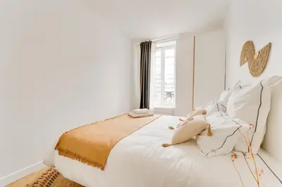Un ou plusieurs lits dans un hébergement de l'établissement PorteMaillot & La Défense 4 Bedroom 10 people