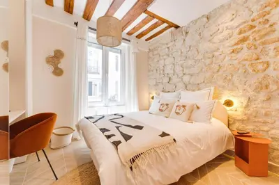 Un ou plusieurs lits dans un hébergement de l'établissement Opera Sentier Appartement avec Spa et Cinéma