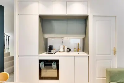 Cuisine ou kitchenette dans l'établissement Opera Sentier Appartement avec Spa et Cinéma