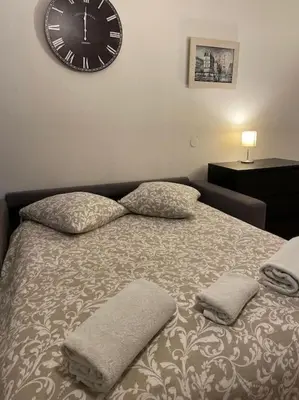 Un ou plusieurs lits dans un hébergement de l'établissement Studio Paris 14