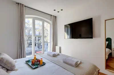 Un ou plusieurs lits dans un hébergement de l'établissement 343 Suite Jad - Superbe Appartement à Paris