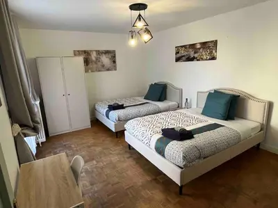 Un ou plusieurs lits dans un hébergement de l'établissement P1- Maison 2min metro PARIS-EXPO 3 chambres 3 lits