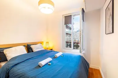 Un ou plusieurs lits dans un hébergement de l'établissement GuestReady - Serene Comfort near Sacré-Cœur