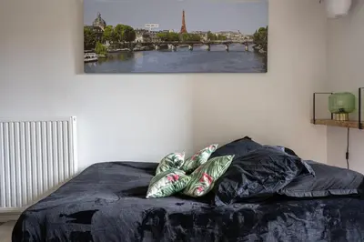 Un ou plusieurs lits dans un hébergement de l'établissement Joli appartement dans Eco quartier résidentiel
