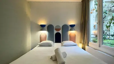Un ou plusieurs lits dans un hébergement de l'établissement Le Majorelle - Calme & Cosy - by Mon Petit Faré