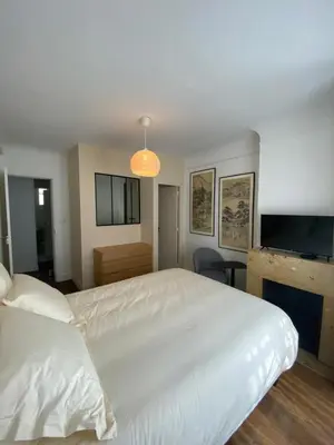 Un ou plusieurs lits dans un hébergement de l'établissement Maison Auguste
