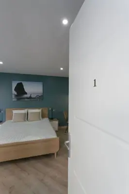 Un ou plusieurs lits dans un hébergement de l'établissement Rose, Appartement Confortable proche Metro