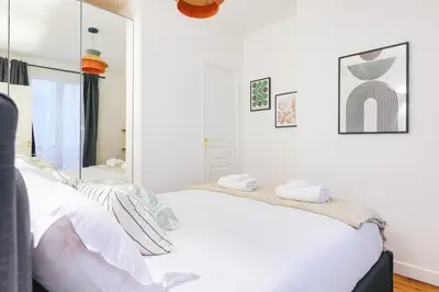 Un ou plusieurs lits dans un hébergement de l'établissement Élégant appartement 1 chambre pour 4 personnes au cœur de Paris, à Bastille